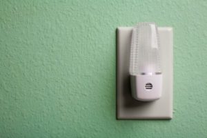 Photo of a nightlight plugged into a wall outlet